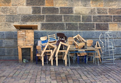 People evaluating old furniture for disposal